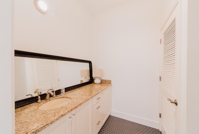 bathroom featuring tile patterned flooring and vanity