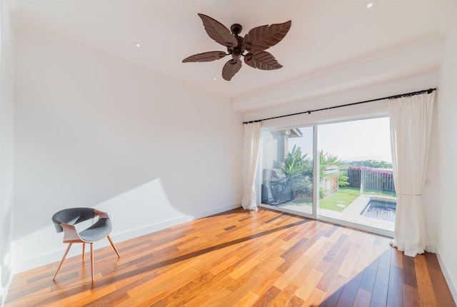 spare room featuring ceiling fan and hardwood / wood-style floors