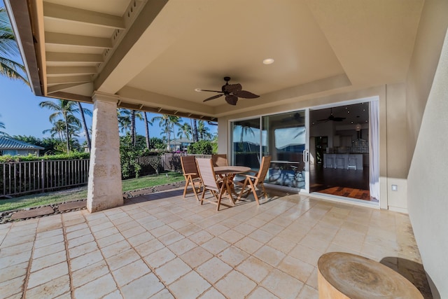 view of patio featuring ceiling fan