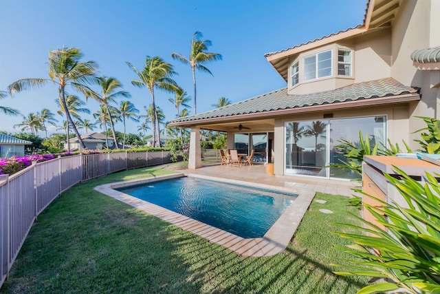 view of pool featuring a yard, a patio, and ceiling fan