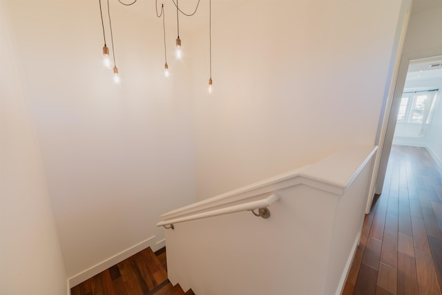 staircase featuring wood-type flooring