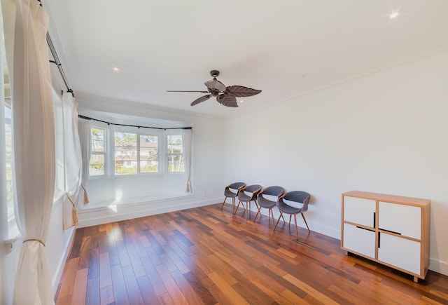 interior space featuring hardwood / wood-style floors, ceiling fan, and crown molding