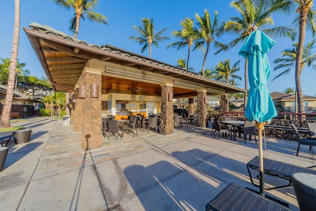 view of patio featuring ceiling fan