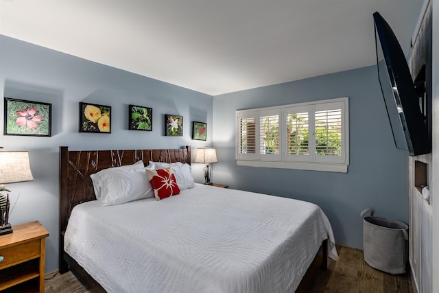 bedroom with wood finished floors
