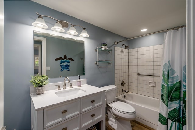 full bath with toilet, shower / bath combo, and vanity