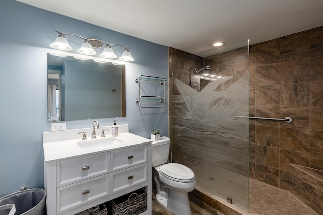 bathroom with vanity, walk in shower, and toilet