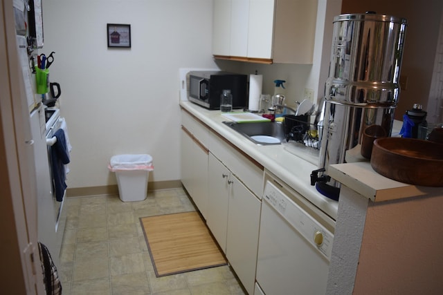 140 Uwapo Rd Unit 41-203, Kihei, HI 96753 - kitchen featuring white dishwasher, black microwave, light countertops, and white cabinets