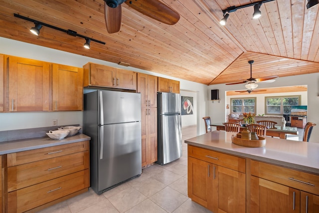 kitchen featuring ceiling fan, wooden ceiling, and freestanding refrigerator