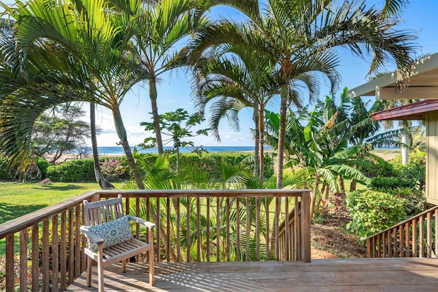 wooden terrace featuring a water view