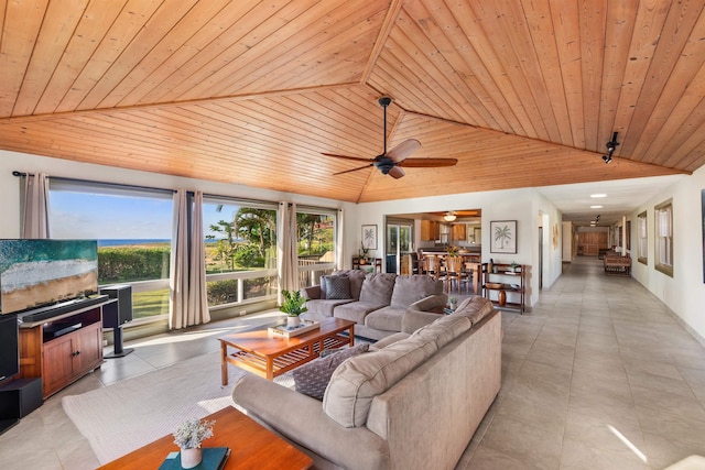 living room with vaulted ceiling, ceiling fan, light tile patterned floors, and wood ceiling