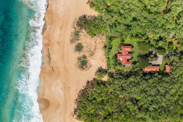 drone / aerial view with a water view and a beach view