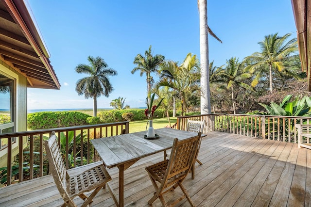 wooden deck featuring outdoor dining area