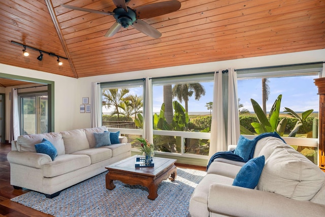 sunroom featuring a ceiling fan, lofted ceiling, wooden ceiling, and rail lighting