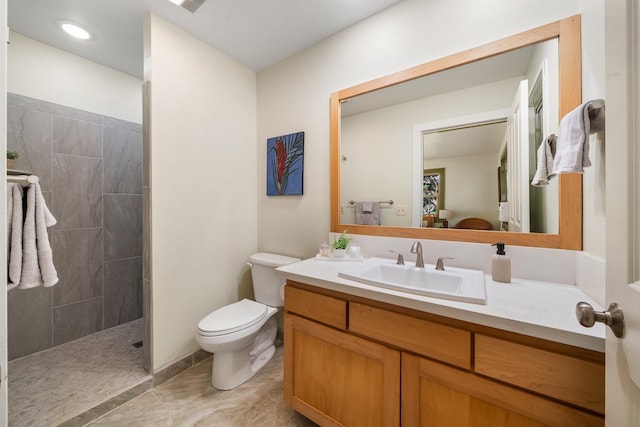 ensuite bathroom featuring a walk in shower, tile patterned flooring, toilet, connected bathroom, and vanity