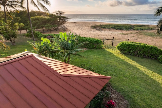 view of yard featuring a water view and a view of the beach