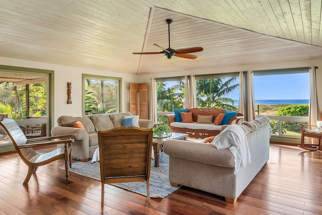 sunroom with vaulted ceiling, plenty of natural light, and wood ceiling