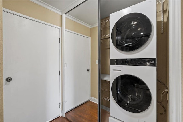 15 Kulanihakoi St Unit 11B, Kihei, HI 96753 - laundry room with estacked washer and dryer, ornamental molding, and dark wood finished floors