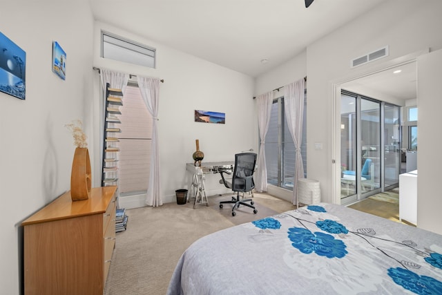 bedroom featuring access to outside and light colored carpet