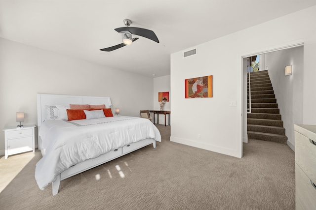 bedroom with light carpet and ceiling fan