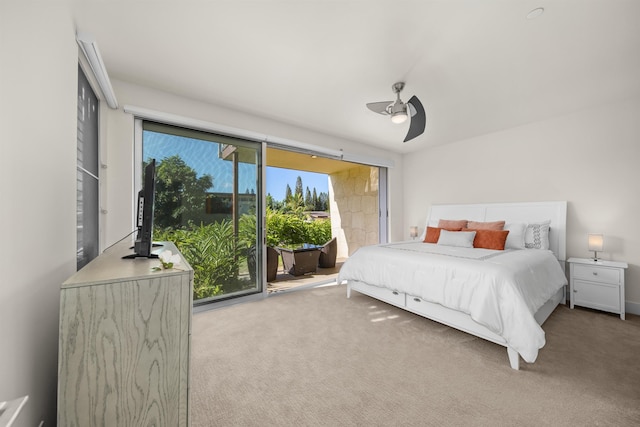 carpeted bedroom featuring access to exterior, ceiling fan, and multiple windows