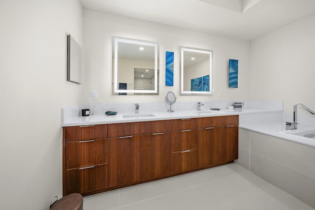 bathroom featuring tile patterned flooring, vanity, and a bathtub