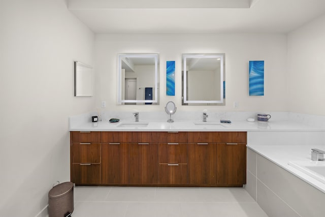 bathroom with tile patterned flooring, vanity, and a tub to relax in