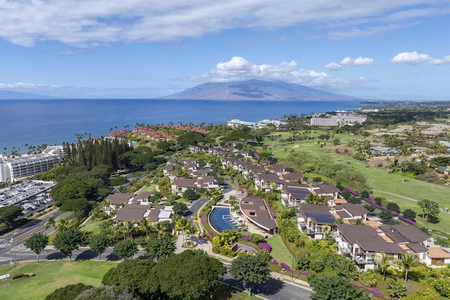 drone / aerial view featuring a water and mountain view