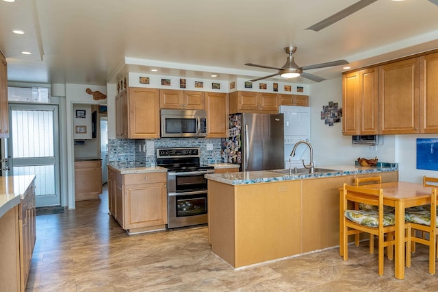 kitchen with tasteful backsplash, sink, ceiling fan, stainless steel appliances, and light stone countertops