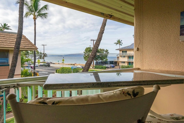 balcony featuring a water view