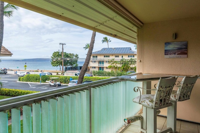 balcony featuring a water view