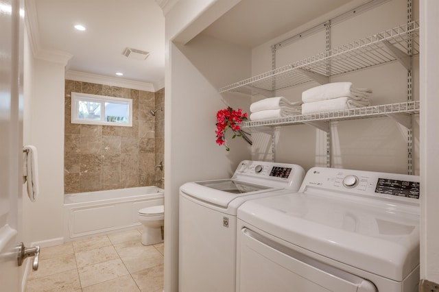 laundry room featuring light tile patterned floors, recessed lighting, visible vents, ornamental molding, and washing machine and dryer