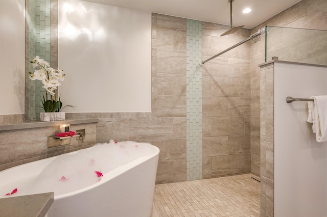 bathroom with a freestanding bath and walk in shower