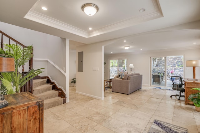 interior space featuring stairs, electric panel, a raised ceiling, and crown molding