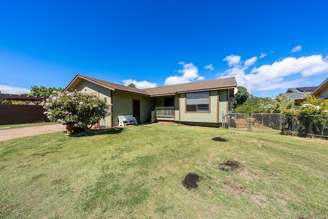 ranch-style home featuring a front yard