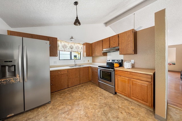 kitchen with stainless steel appliances, light tile patterned floors, lofted ceiling with beams, and hanging light fixtures