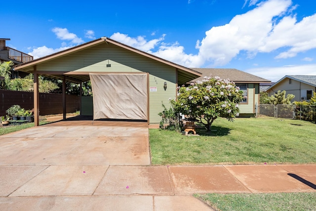 exterior space featuring a front lawn and a carport