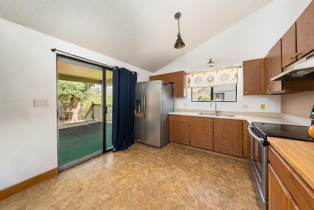 kitchen featuring sink, appliances with stainless steel finishes, a healthy amount of sunlight, and light tile patterned floors