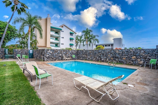 view of swimming pool with a patio area