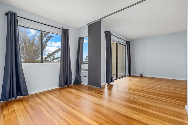 unfurnished room featuring light hardwood / wood-style flooring