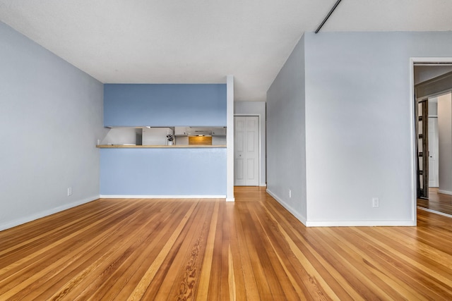 unfurnished living room with light hardwood / wood-style floors