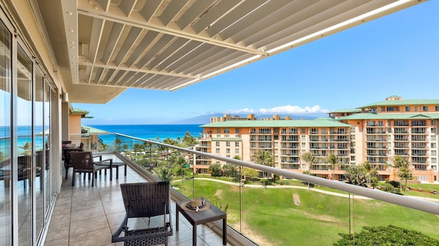 balcony featuring a water view