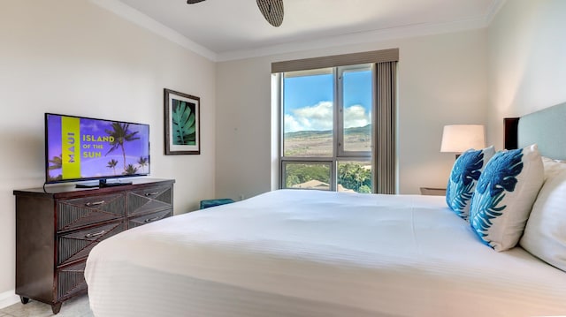 bedroom featuring ceiling fan and ornamental molding