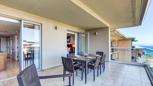 balcony featuring a water view