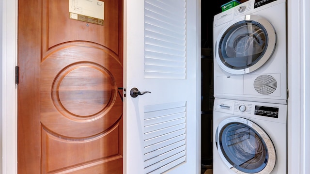 clothes washing area with stacked washer / drying machine