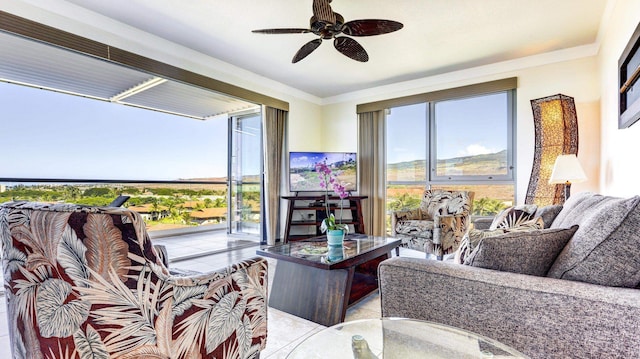 interior space with ceiling fan and ornamental molding