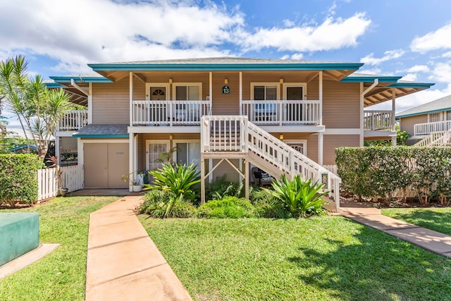 480 Kenolio Rd Unit 13-101, Kihei, HI 96753 - view of front of house with stairway and covered porch