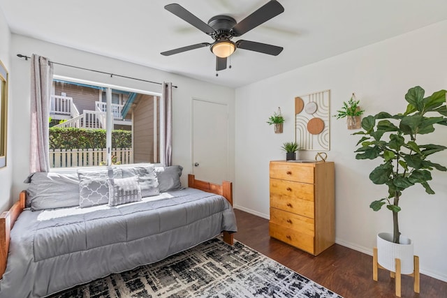 480 Kenolio Rd Unit 13-101, Kihei, HI 96753 - bedroom with dark wood-type flooring, baseboards, and a ceiling fan