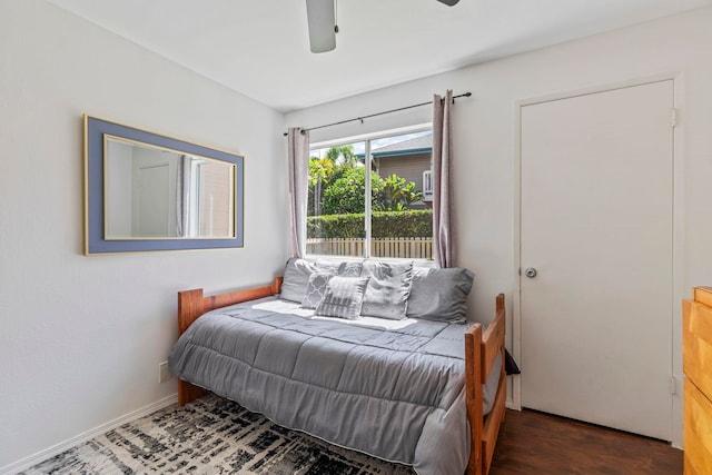 480 Kenolio Rd Unit 13-101, Kihei, HI 96753 - bedroom with a ceiling fan and wood finished floors