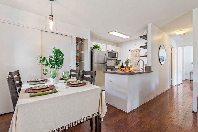 480 Kenolio Rd Unit 13-101, Kihei, HI 96753 - dining space featuring dark wood-style floors