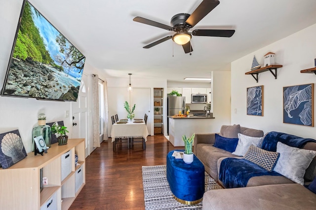 480 Kenolio Rd Unit 13-101, Kihei, HI 96753 - living room with dark wood-style flooring and ceiling fan